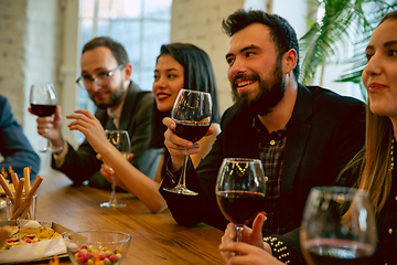 Image showing Happy co-workers celebrating while company party and corporate event