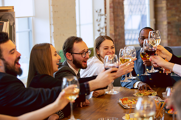 Image showing Happy co-workers celebrating while company party and corporate event