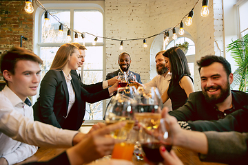 Image showing Happy co-workers celebrating while company party and corporate event