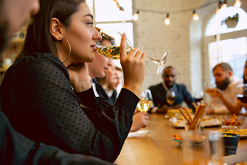 Image showing Happy co-workers celebrating while company party and corporate event