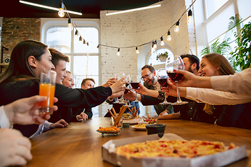 Image showing Happy co-workers celebrating while company party and corporate event