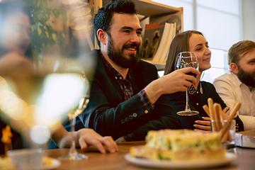 Image showing Happy co-workers celebrating while company party and corporate event