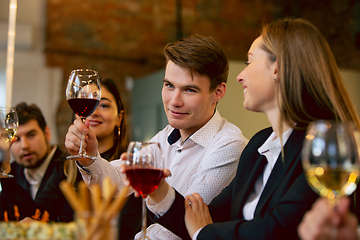 Image showing Happy co-workers celebrating while company party and corporate event