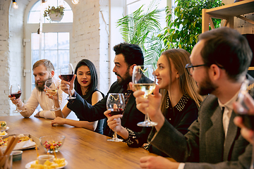 Image showing Happy co-workers celebrating while company party and corporate event