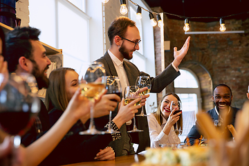 Image showing Happy co-workers celebrating while company party and corporate event