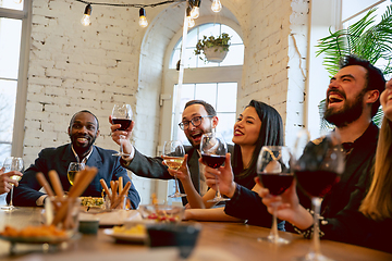 Image showing Happy co-workers celebrating while company party and corporate event