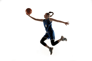 Image showing Young caucasian female basketball player against white studio background