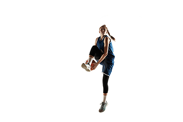 Image showing Young caucasian female basketball player against white studio background