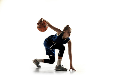 Image showing Young caucasian female basketball player against white studio background