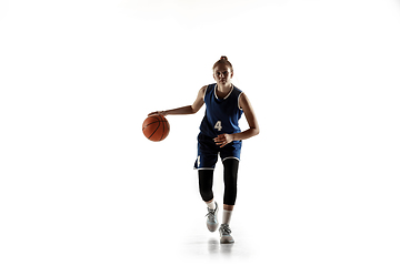 Image showing Young caucasian female basketball player against white studio background