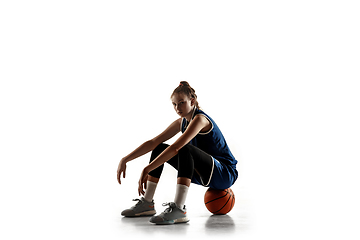 Image showing Young caucasian female basketball player against white studio background