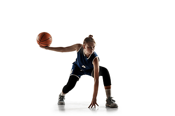 Image showing Young caucasian female basketball player against white studio background