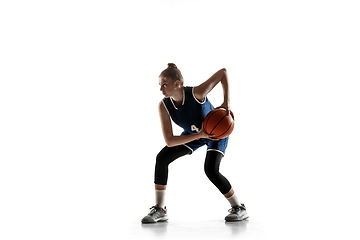 Image showing Young caucasian female basketball player against white studio background