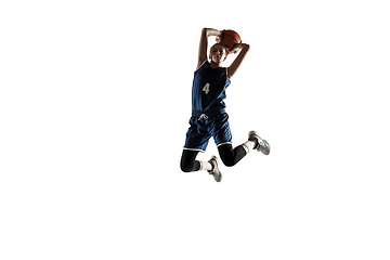 Image showing Young caucasian female basketball player against white studio background