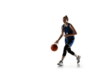 Image showing Young caucasian female basketball player against white studio background