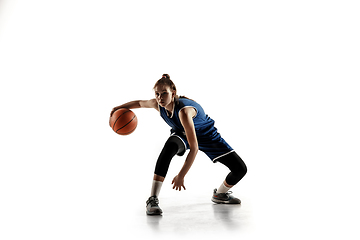 Image showing Young caucasian female basketball player against white studio background