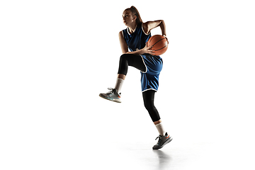 Image showing Young caucasian female basketball player against white studio background