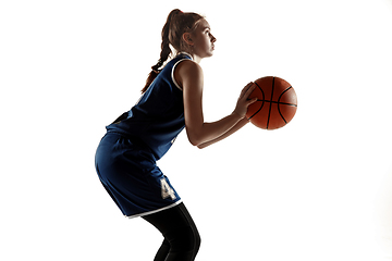 Image showing Young caucasian female basketball player against white studio background