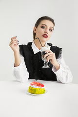 Image showing We are what we eat. Woman\'s eating plastic food, eco concept