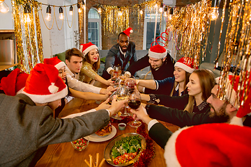 Image showing Happy co-workers celebrating while company party for New Year and Christmas