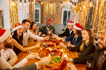 Image showing Happy co-workers celebrating while company party for New Year and Christmas