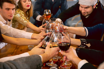 Image showing Happy co-workers celebrating while company party for New Year and Christmas