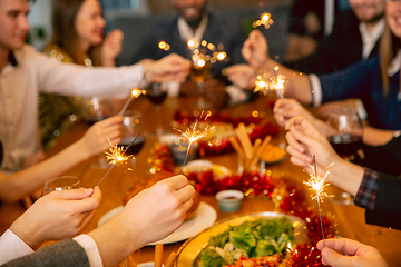 Image showing Happy co-workers celebrating while company party for New Year and Christmas