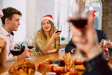 Image showing Happy co-workers celebrating while company party for New Year and Christmas