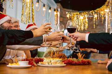 Image showing Happy co-workers celebrating while company party for New Year and Christmas