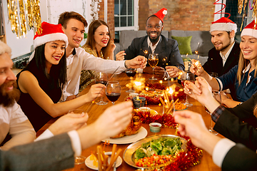 Image showing Happy co-workers celebrating while company party for New Year and Christmas