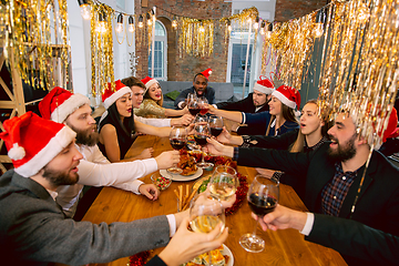 Image showing Happy co-workers celebrating while company party for New Year and Christmas