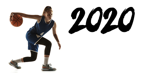 Image showing Young caucasian female basketball player on white studio background