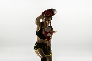 Image showing Fit caucasian woman in sportswear boxing isolated on white studio background