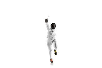 Image showing Teen girl in fencing costume with sword in hand isolated on white background