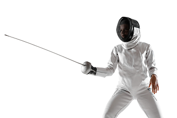 Image showing Teen girl in fencing costume with sword in hand isolated on white background