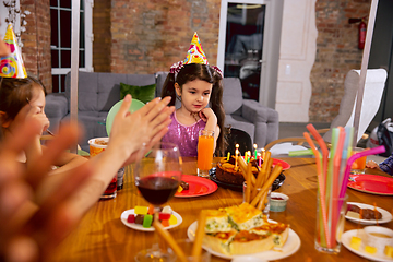 Image showing Little happy girl celebrating a birthday at home