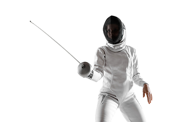 Image showing Teen girl in fencing costume with sword in hand isolated on white background