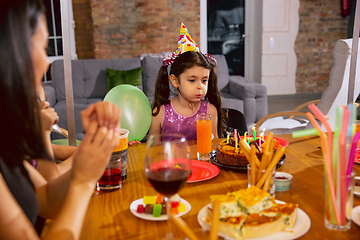 Image showing Mother and daughter celebrating a birthday at home