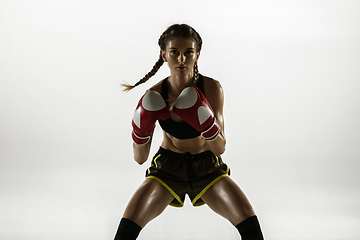 Image showing Fit caucasian woman in sportswear boxing isolated on white studio background
