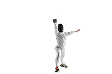 Image showing Teen girl in fencing costume with sword in hand isolated on white background