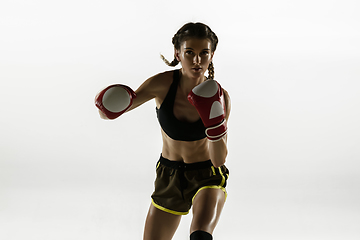 Image showing Fit caucasian woman in sportswear boxing isolated on white studio background