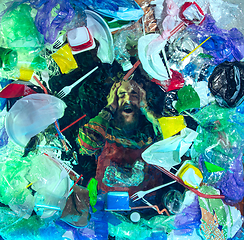 Image showing Man drowning in ocean water under plastic recipients pile, environment concept