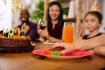 Image showing Close up of hand with sweets while celebrating a birthday at home