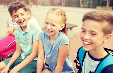 Image showing group of happy elementary school students talking