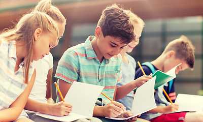 Image showing group of happy elementary school students outdoors