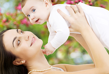 Image showing mother with baby over spring garden background