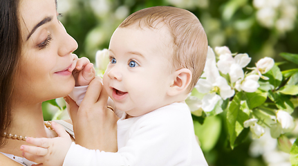 Image showing mother with baby over spring garden background