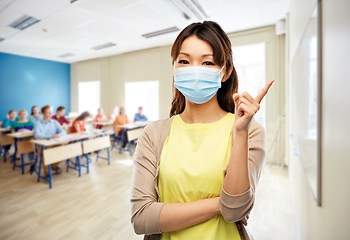 Image showing asian young woman in protective medical mask