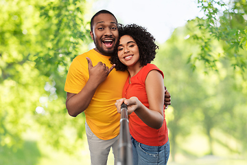 Image showing african couple taking picture by selfie stick