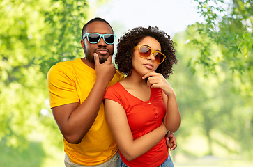 Image showing african couple in sunglasses thinking